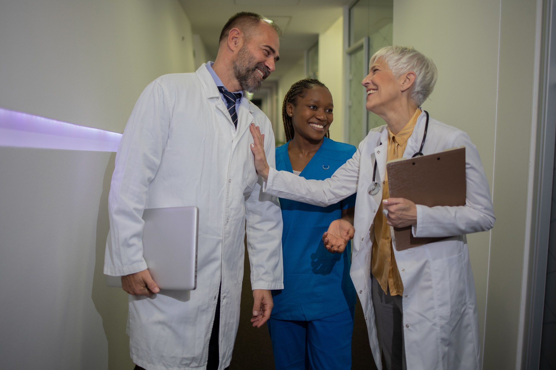 Doctor and nurse discussing patient case at hospital